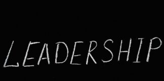 leadership lettering text on black background
